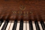 It's a small-to-medium size upright piano, on wheels, made in the 1930...