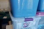22 plastic totes with handles approx 60L and 20 lbs each, stackable