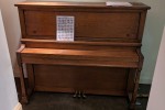 It's a small-to-medium size upright piano, on wheels, made in the 1930...