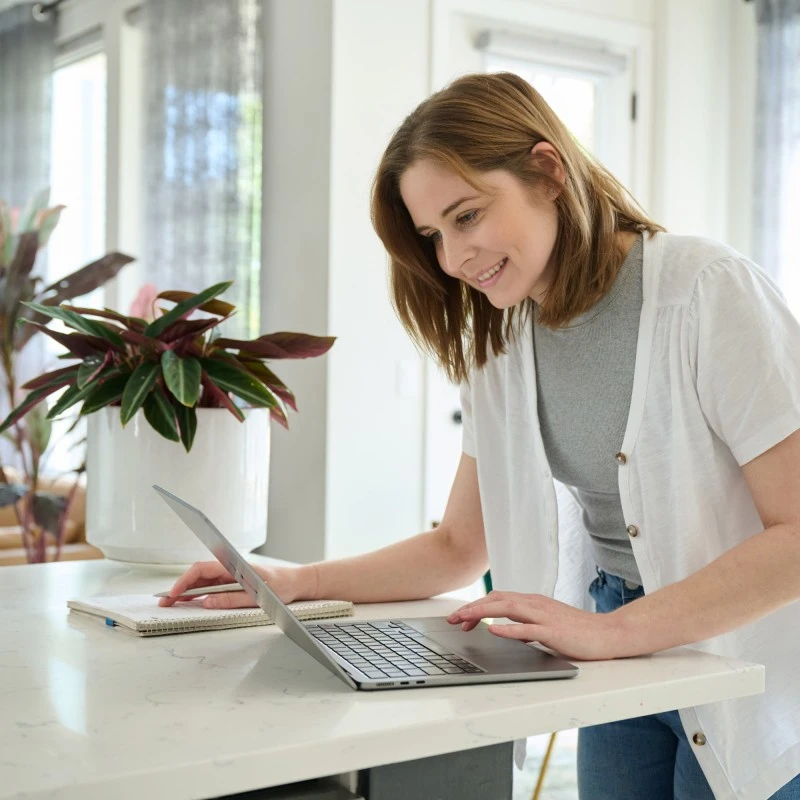 A woman creating a delivery listing online