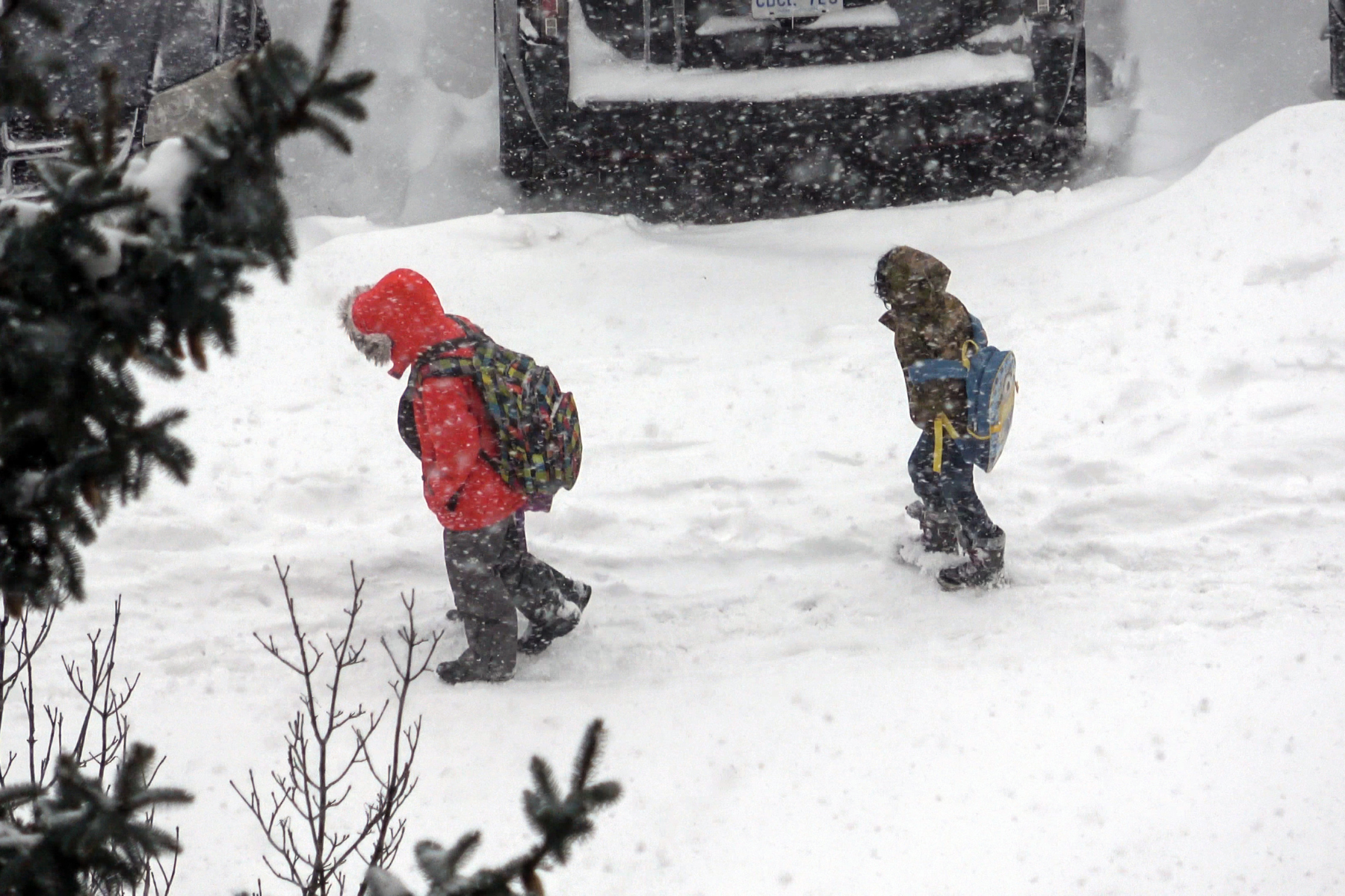  School kids walking home with heavy snow on the ground as major winter storm hit cities in Ontario