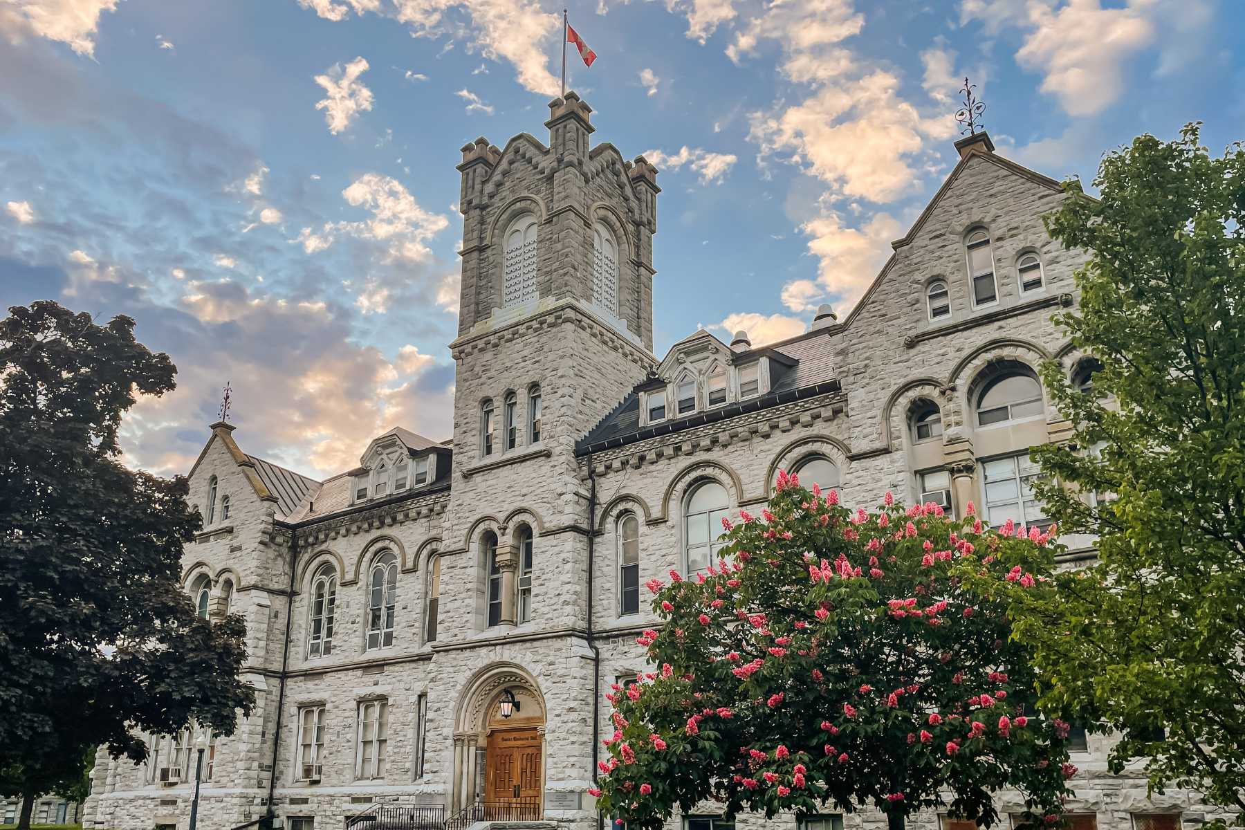 Stone building on Queen's University campus on a summer day