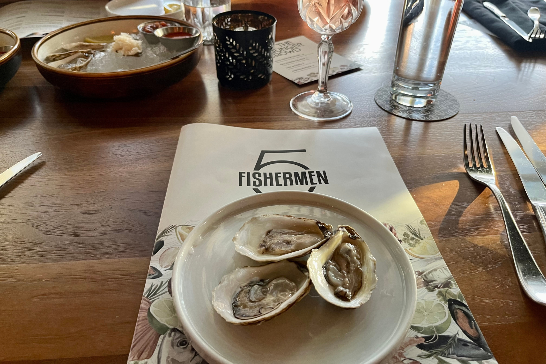 Three oysters on a plate at the 5 Fisherman restaurant in Halifax