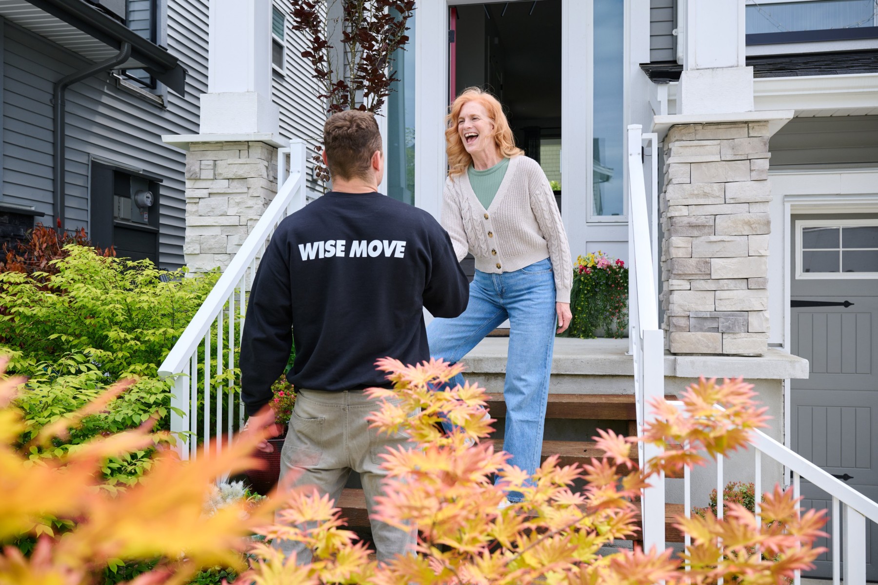 Women meeting movers to help her move to her new retirement community