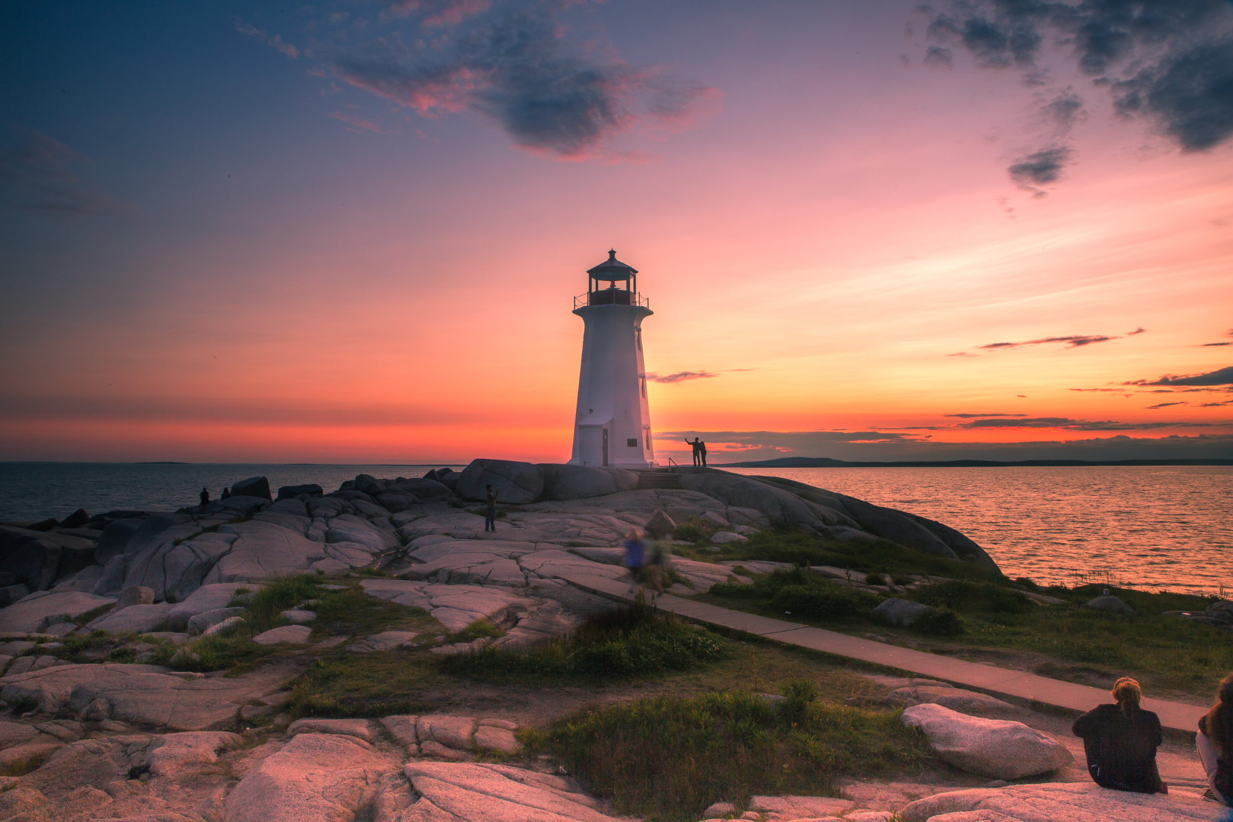 A dramatic sunset at Peggy's Cove Lighthouse in Halifax