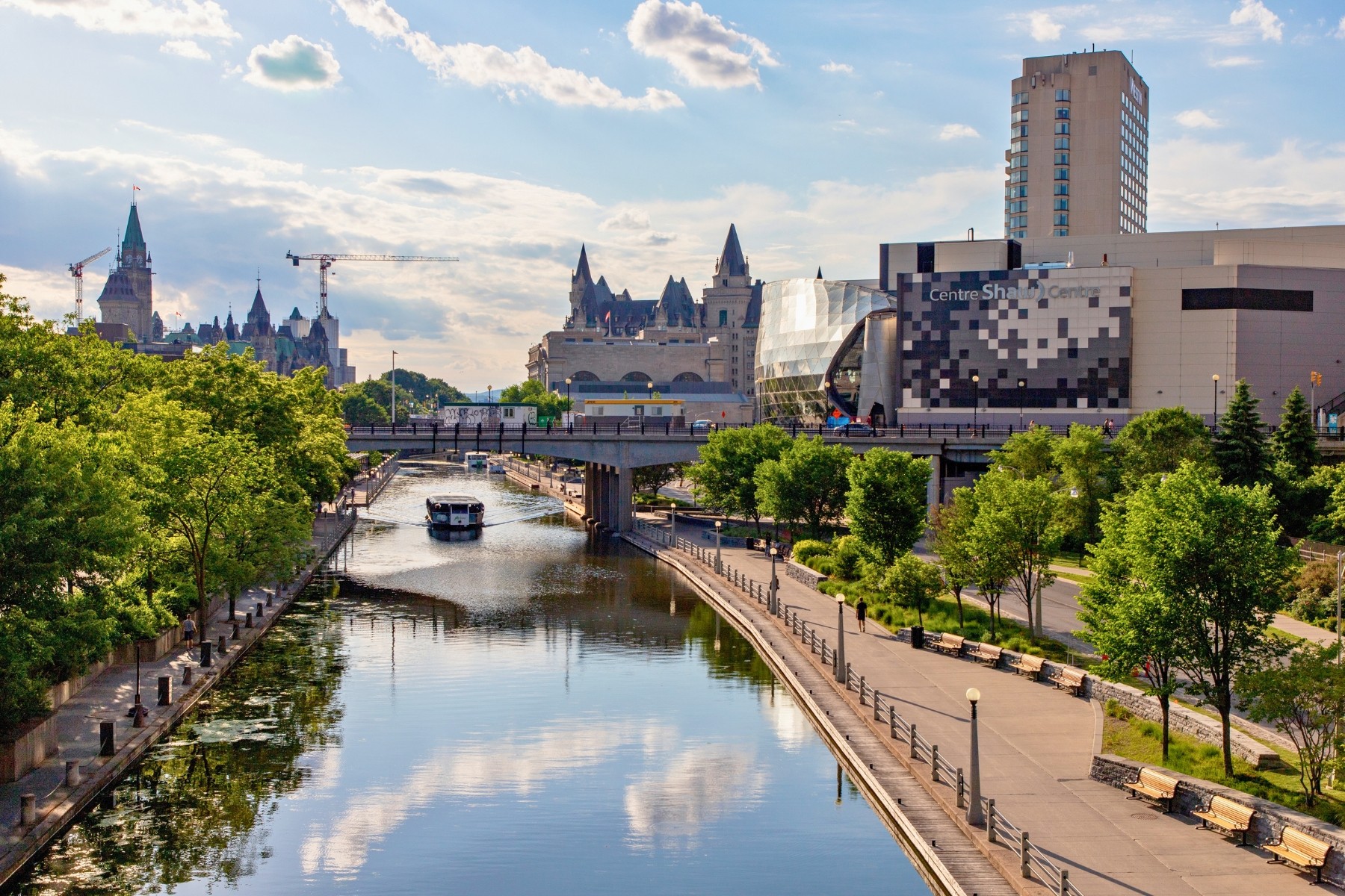 View of Rideau Canal with downtown Ottawa cityscape in the background